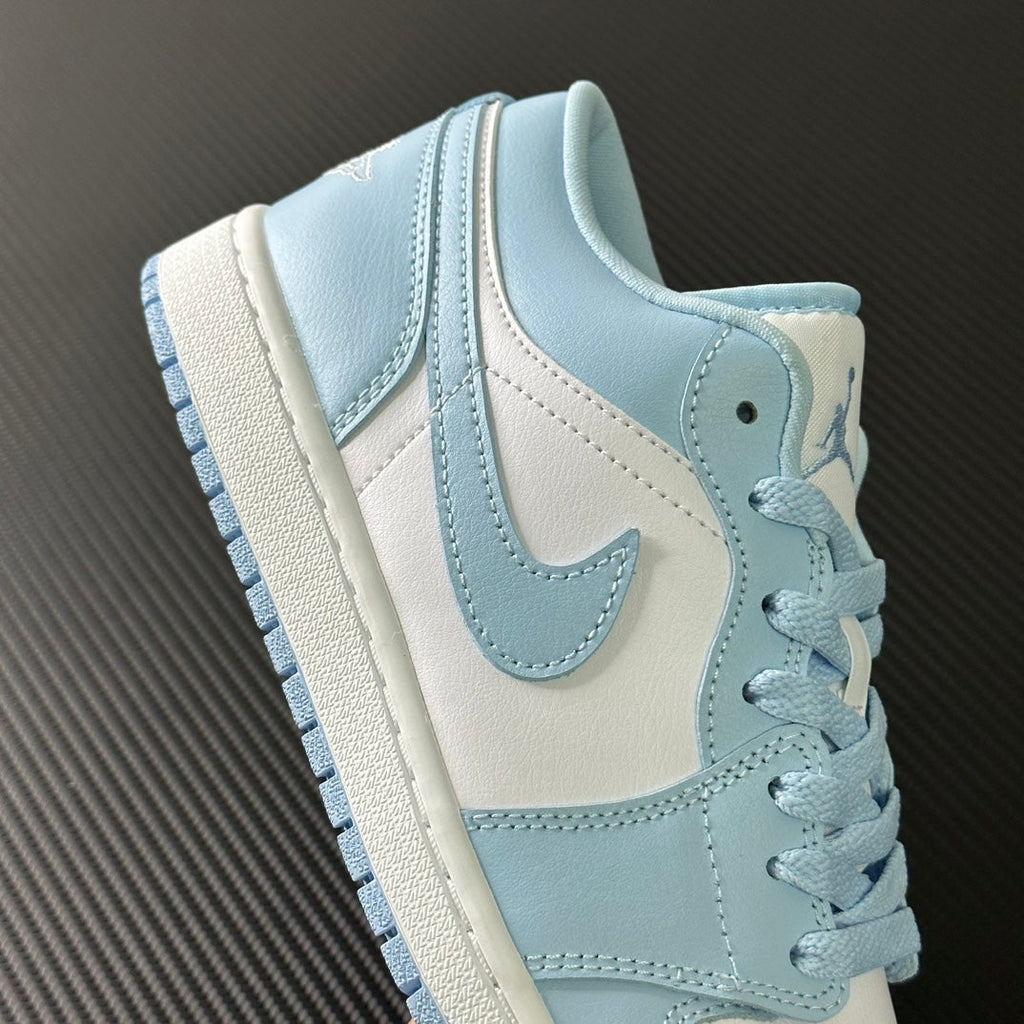 Light blue and cream low-top sneakers with lace-up and padded collar