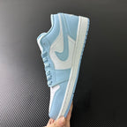 Light blue and cream low-top sneakers, side view with swoosh and laces