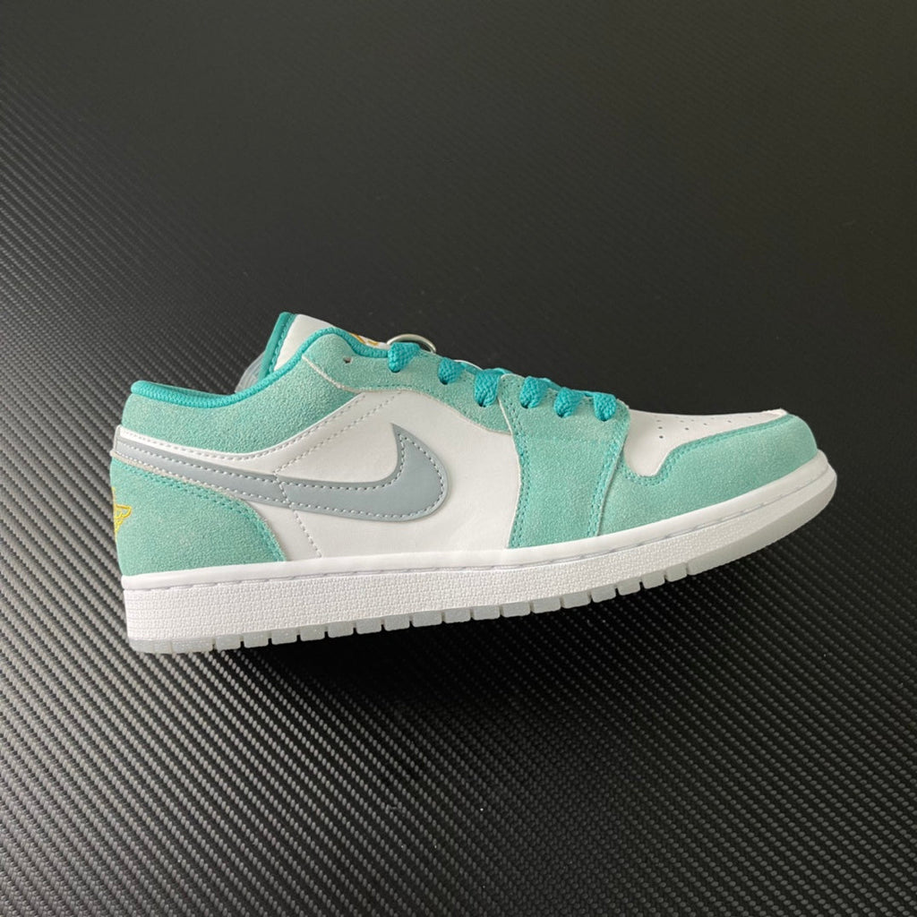 Air Jordan 1 Low sneakers in teal and white, side view with swoosh