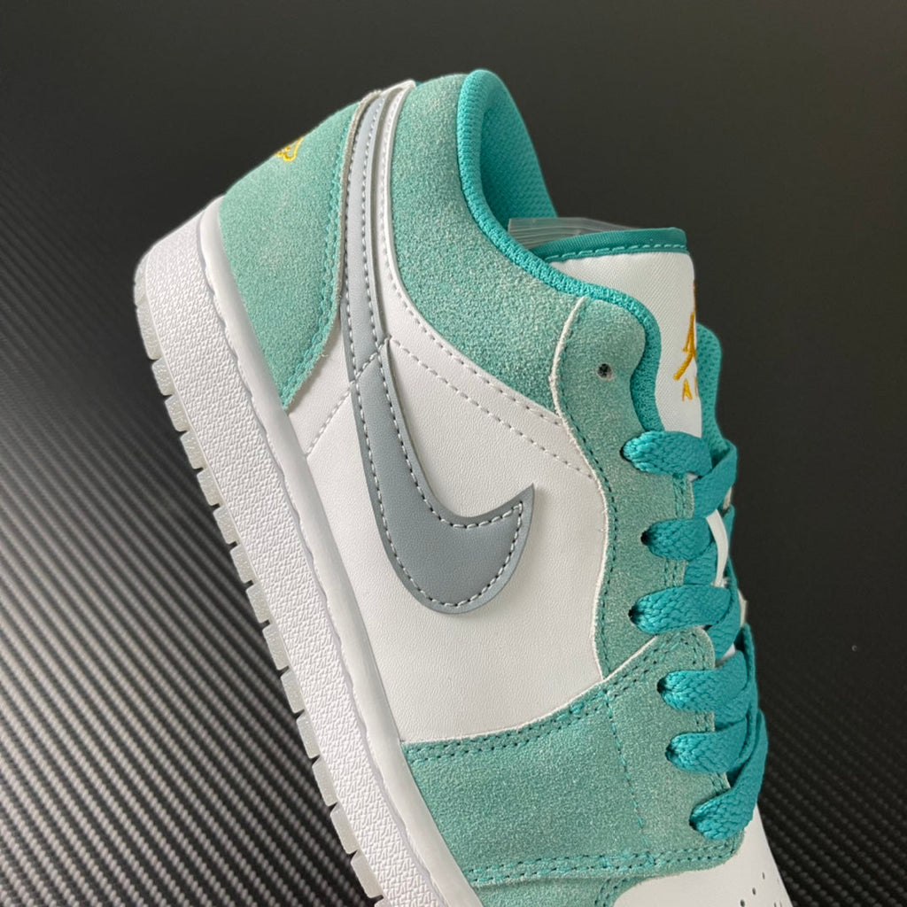 Air Jordan 1 Low sneaker side and heel in teal suede with white leather and laces