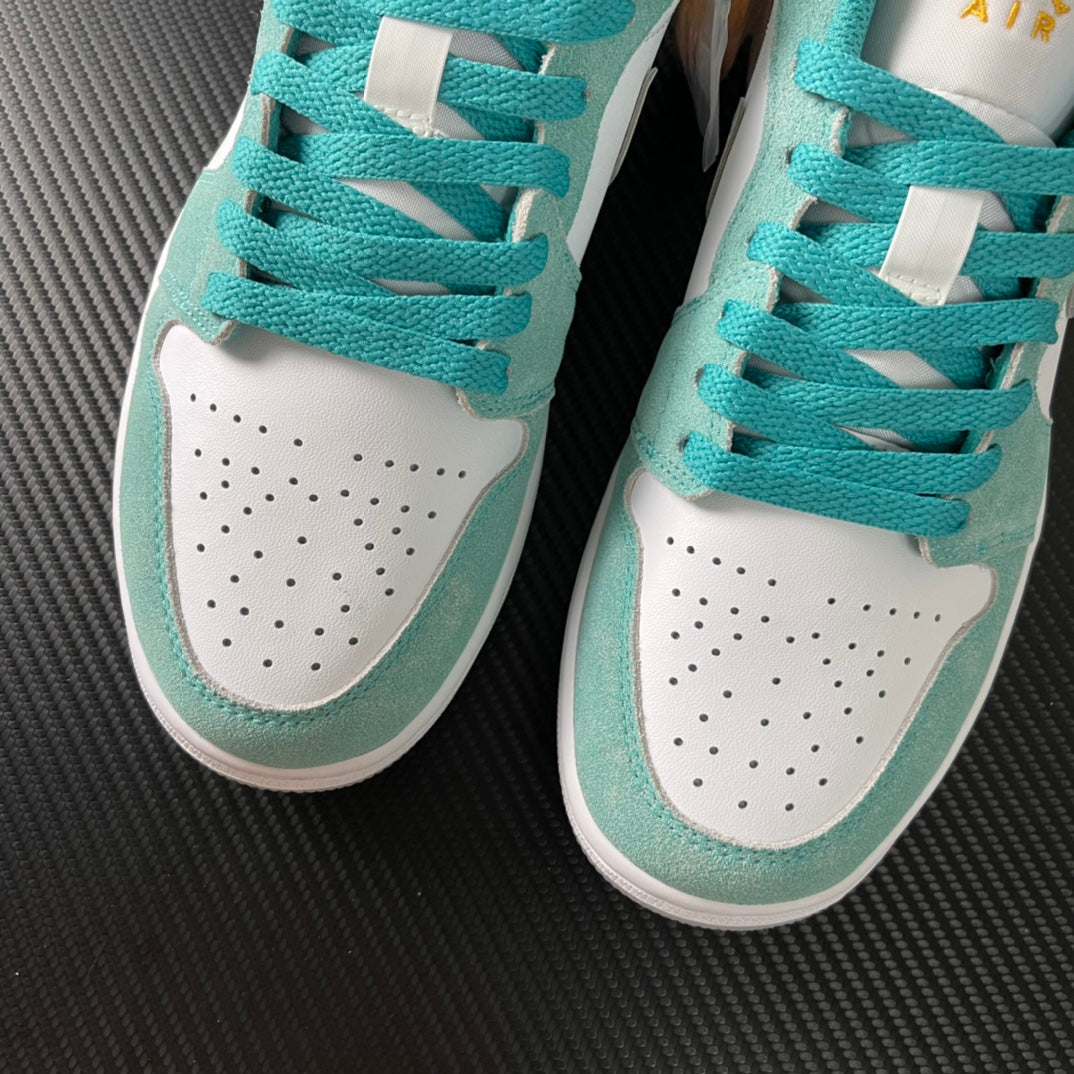 Air Jordan 1 Low sneakers in teal and white with perforated toe and lace panels