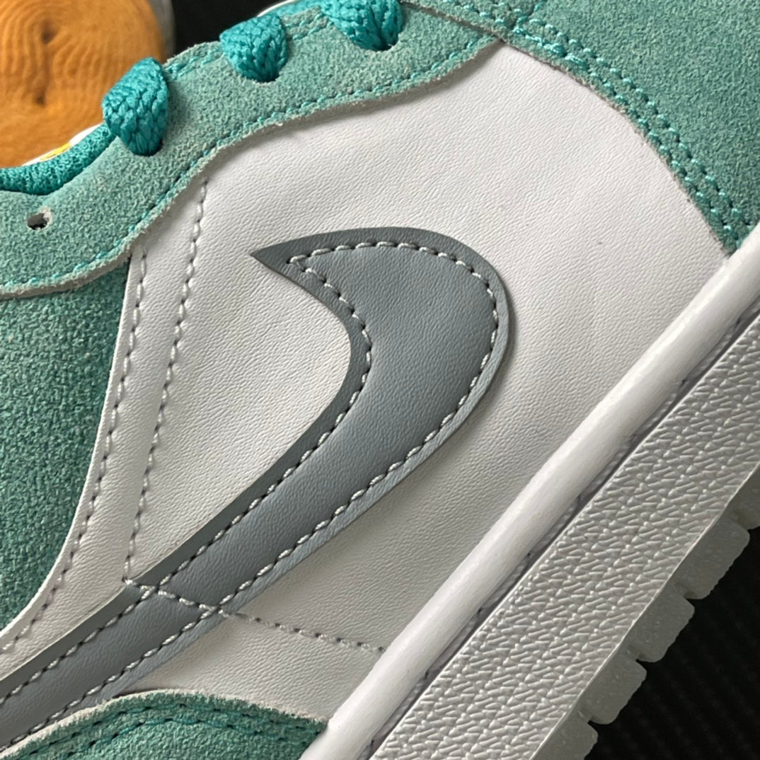 Air Jordan 1 Low sneaker side swoosh detail in gray on white with teal trim