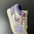 Low-top sneaker quarter view with lilac, cream, and pink accents