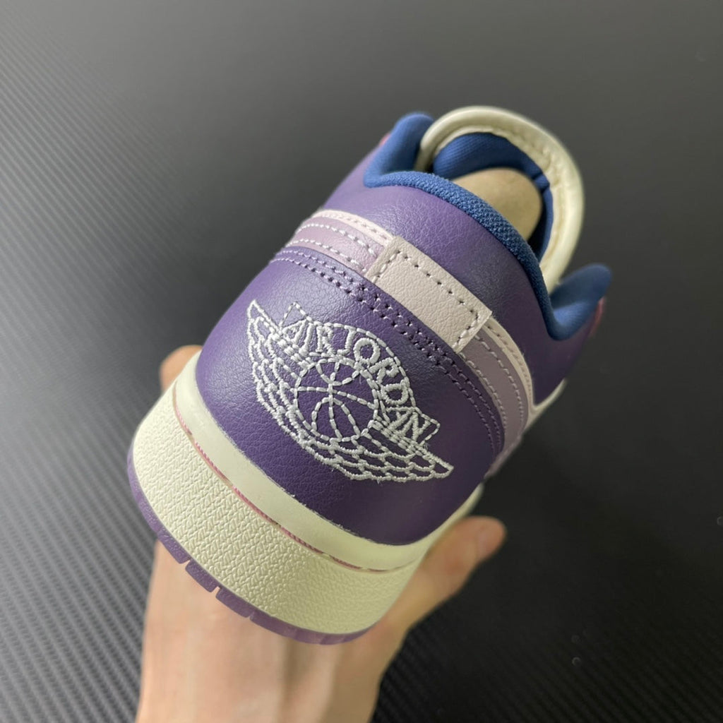 Low-top sneaker heel view with lilac leather, cream sole, embroidered logo