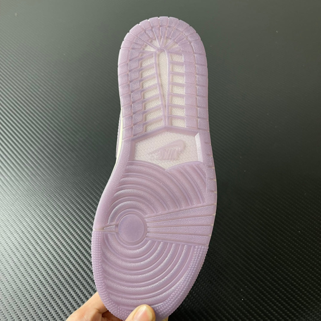 Shoe outsole in light purple with textured tread and center logo