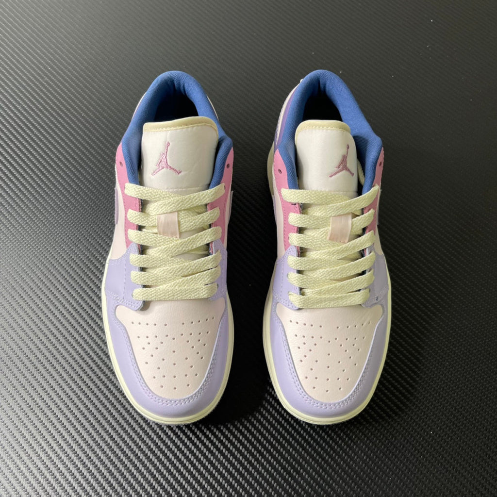 Pair of low-top sneakers, lilac and cream uppers with lime-green laces