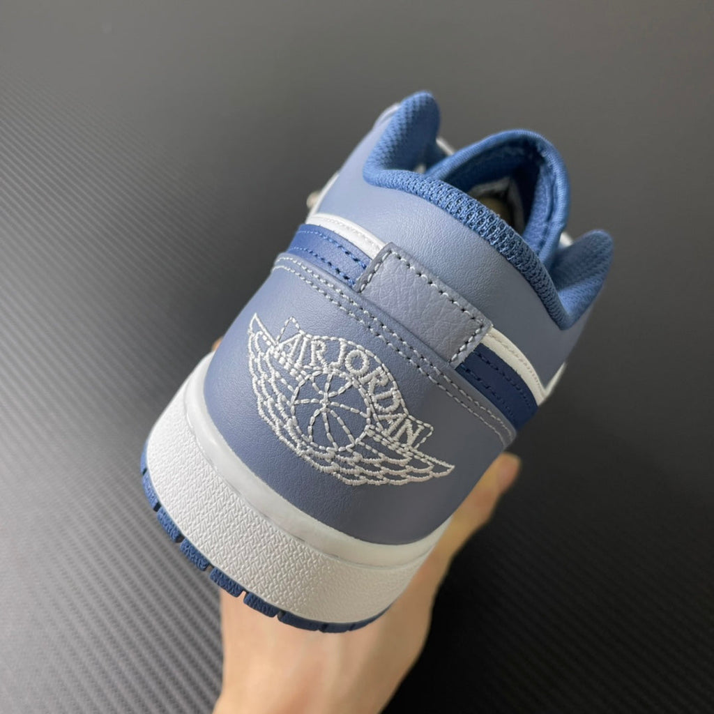 Low-top sneakers heel view with light blue collar and white “Jordan” logo