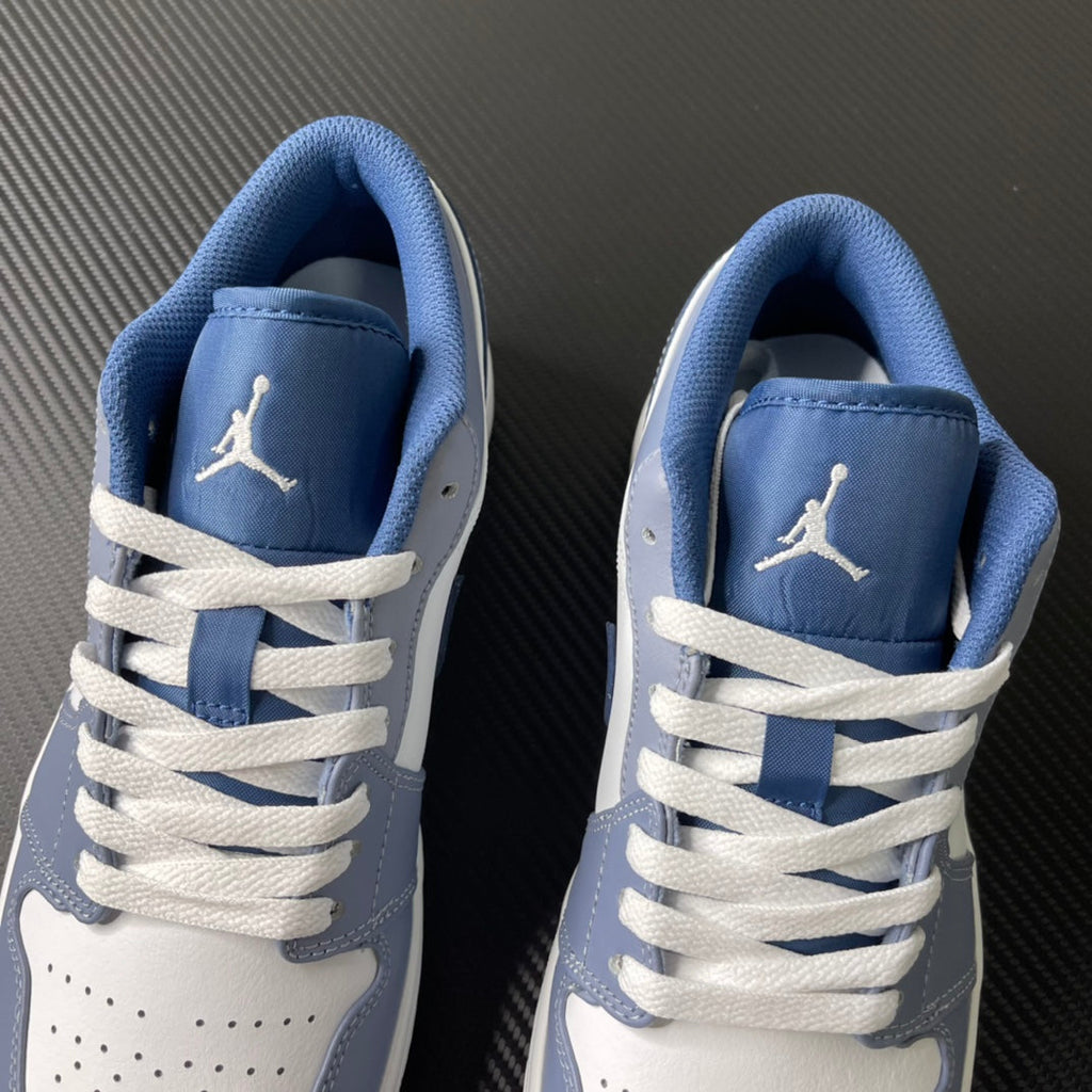 Low-top sneakers heel and lace view with light blue tongue lining and “Jordan” mark
