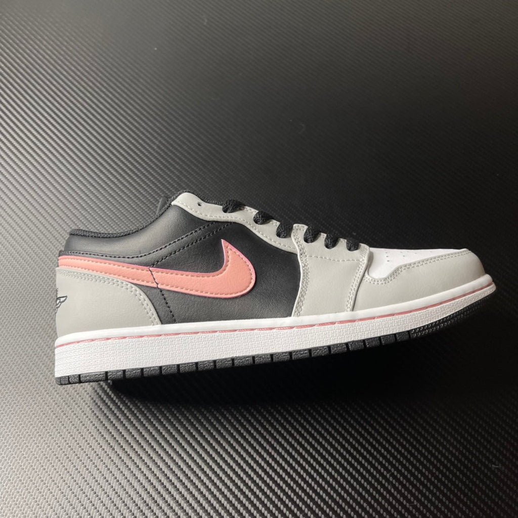 Low-top Air Jordan 1 sneakers, white and black with pink Swoosh