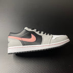 Low-top Air Jordan 1 sneakers, white and black with pink Swoosh