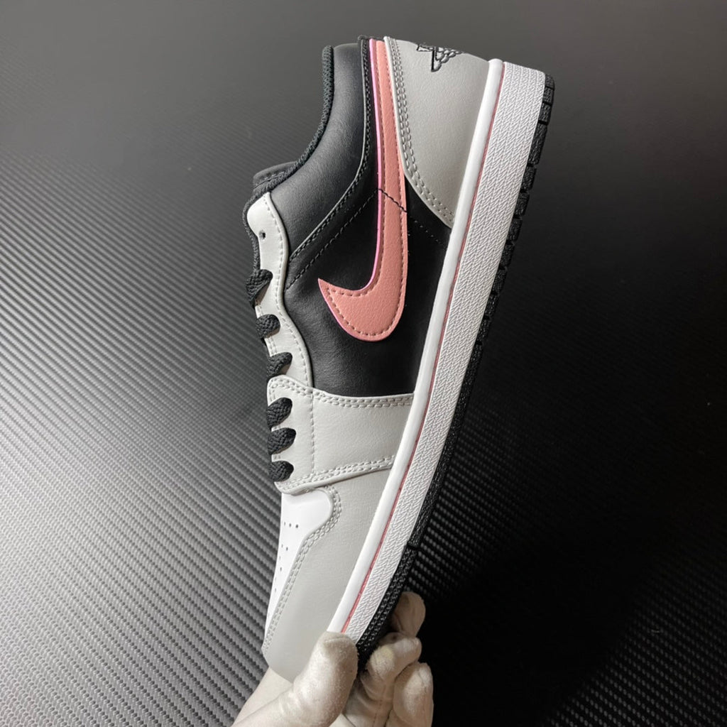 Low-top Air Jordan 1 side view, black and white leather with pink Swoosh