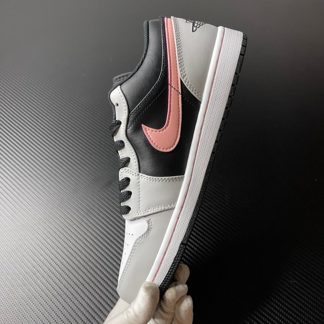 Low-top Air Jordan 1 side view, black and white leather with pink Swoosh