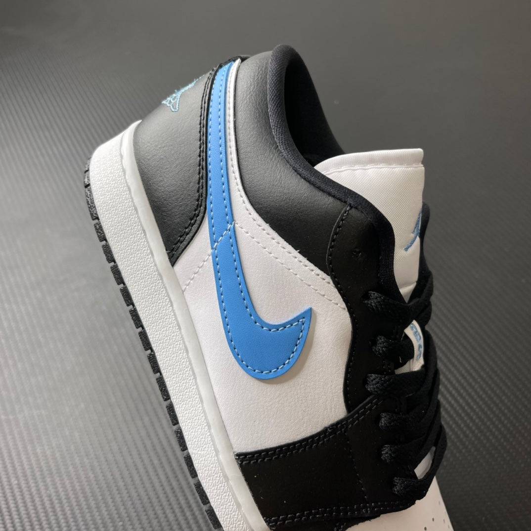 Low-top sneakers side view with black heel and toe, white upper, and light blue stripe.