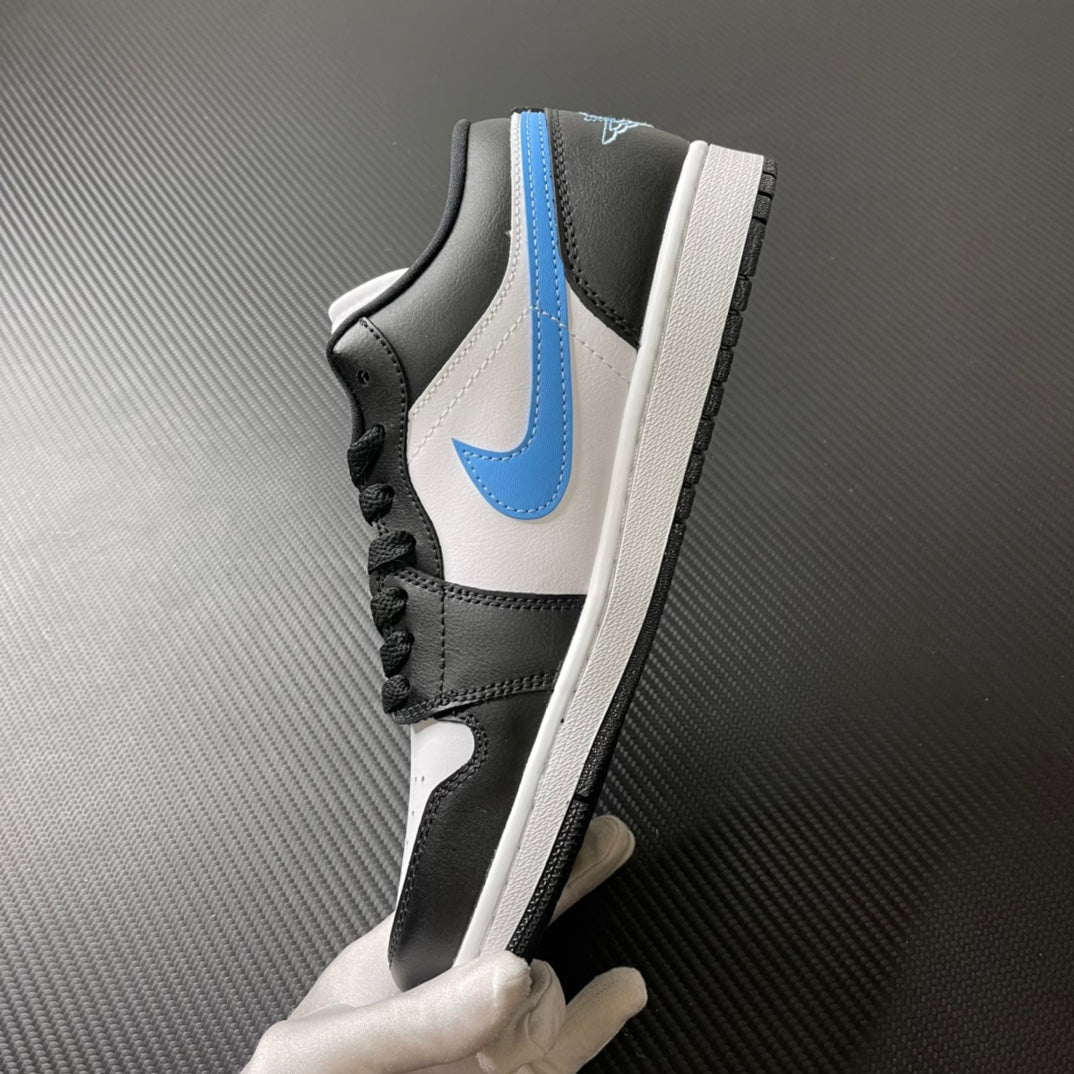 Low-top sneakers front-side view with black laces, white leather, and light blue Swoosh.