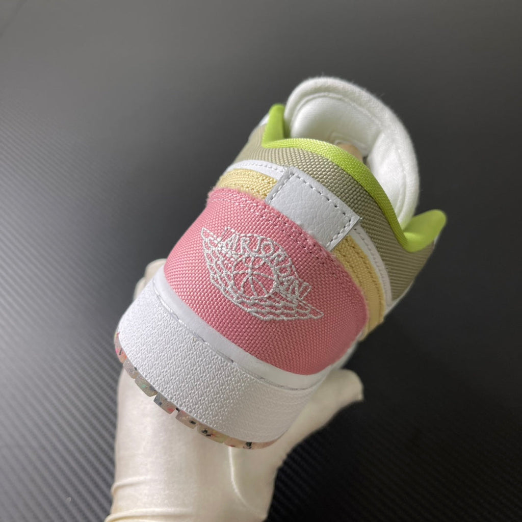 Low-top sneaker heel in white with pink heel patch and neon green collar