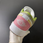 Low-top sneaker heel in white with pink heel patch and neon green collar