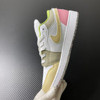 Low-top sneaker side and toe in white with olive and yellow accents