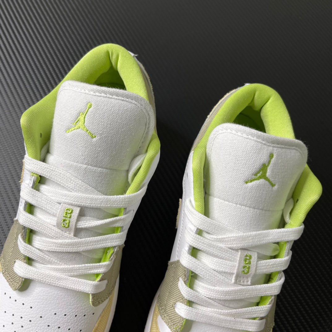 Pair of low-top sneakers with white heel panels and neon green interior