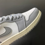 Low-top sneakers side view, light gray laces, white leather with stitched overlays