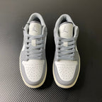 Low-top sneakers pair, white uppers with gray laces and padded tongue
