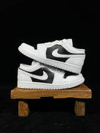 Air Jordan 1 Low sneakers, white uppers with black swoosh and panels