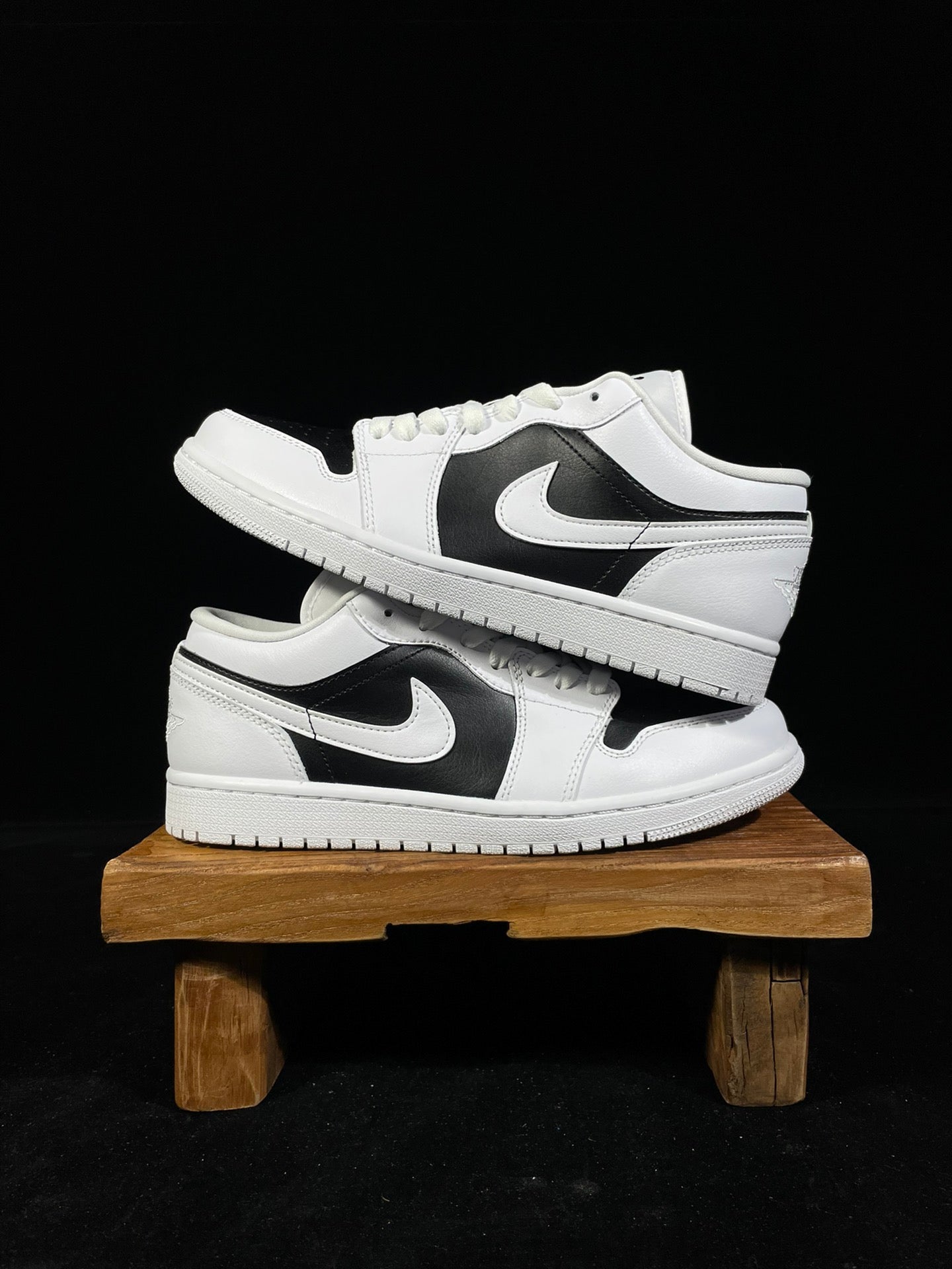 Air Jordan 1 Low sneakers, white uppers with black swoosh and panels