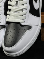 Air Jordan 1 Low sneaker toe box and laces with white leather perforations