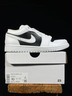 Air Jordan 1 Low sneakers on box, white leather with black swoosh side panel