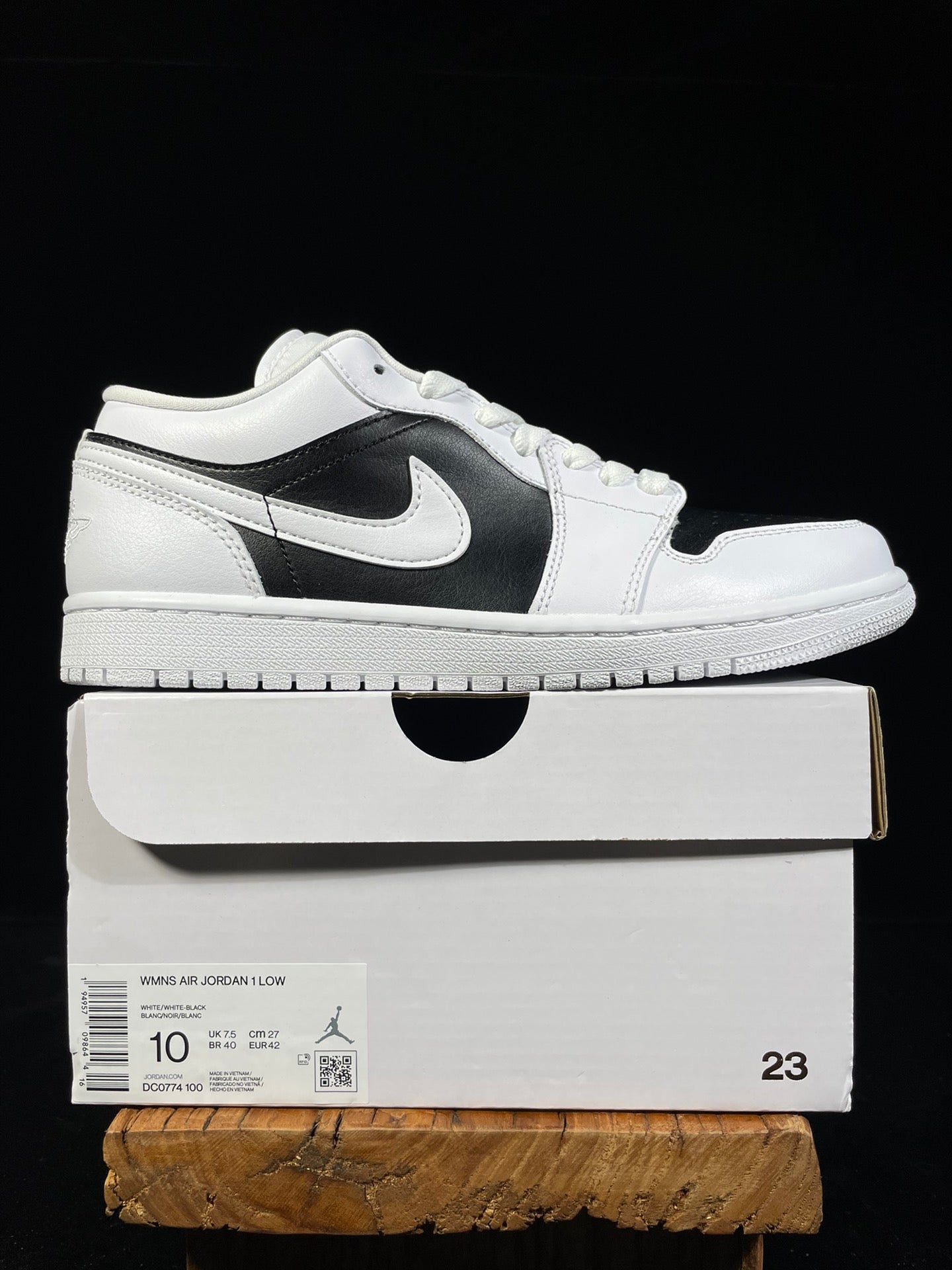 Air Jordan 1 Low sneakers on box, white leather with black swoosh side panel