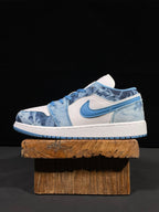 Air Jordan 1 Low sneaker in white and washed denim blue with blue Swoosh