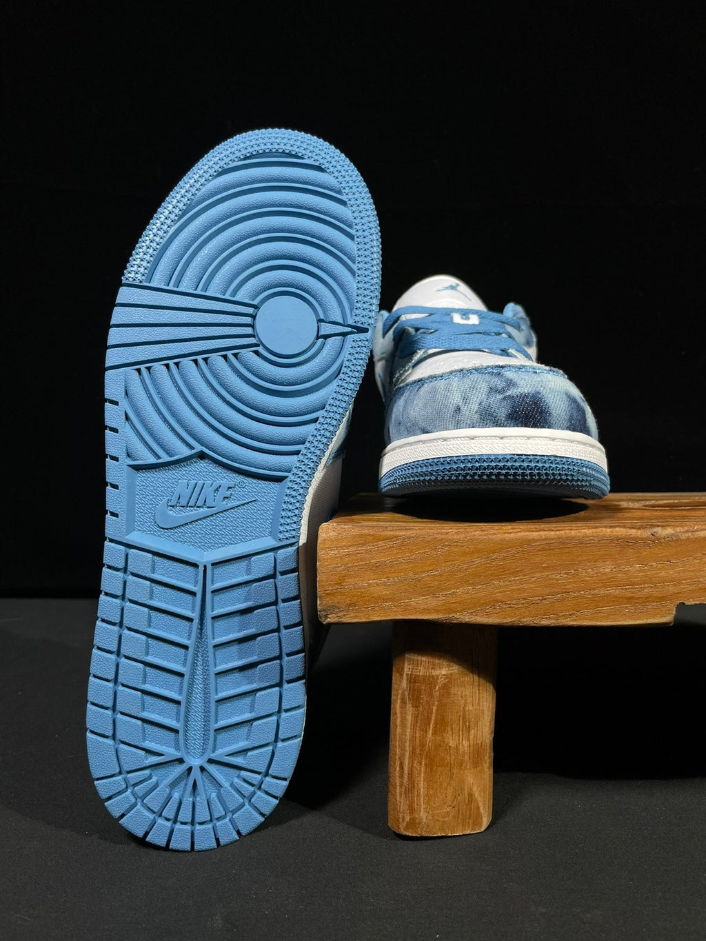 Air Jordan 1 Low sneaker showing outsole and heel detail in blue