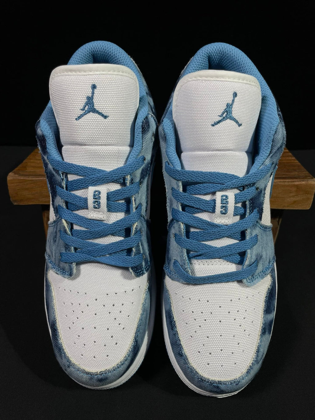 Air Jordan 1 Low sneaker close-up of heel with Air Jordan Jumpman logo