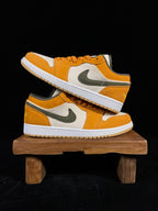 Pair of orange and white low-top sneakers with olive Nike swoosh, front and side views.