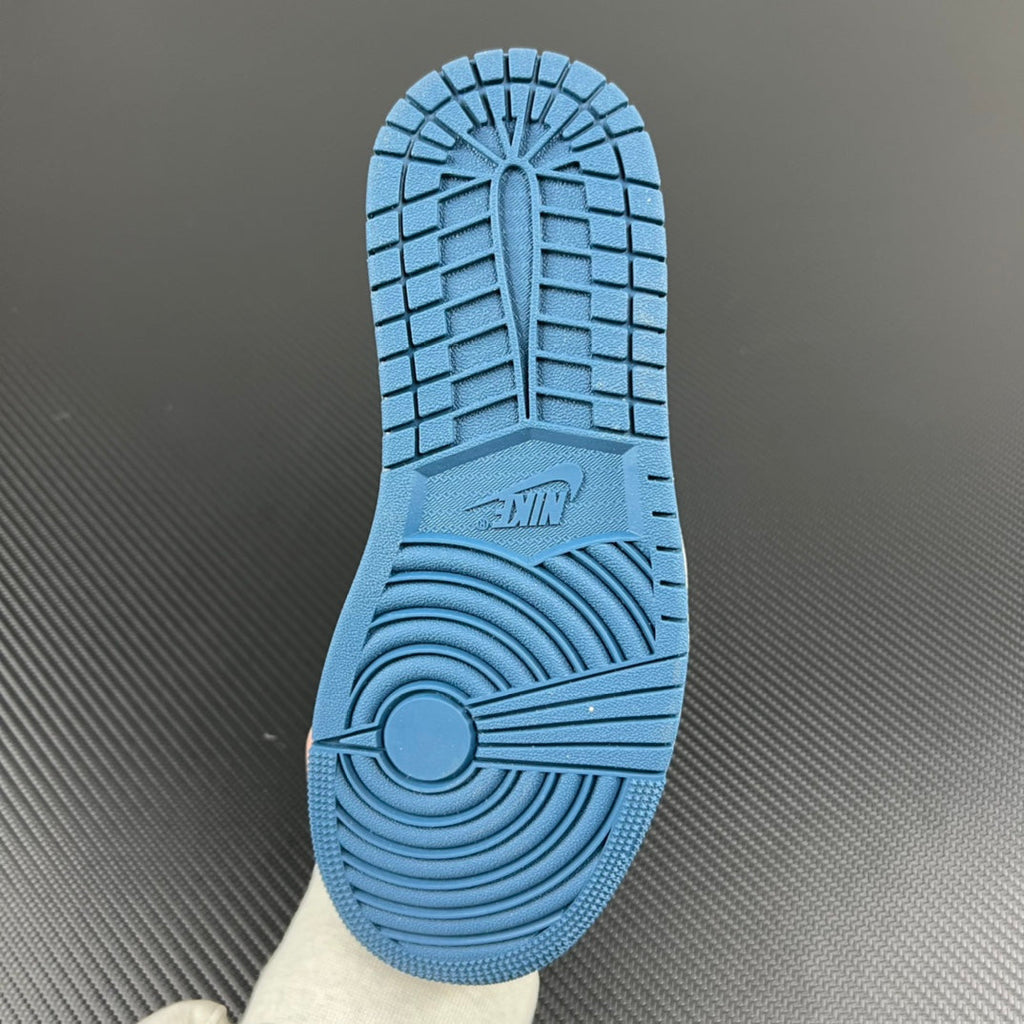 Blue rubber outsole with traction tread pattern and Nike logo at the forefoot.