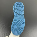 Blue rubber outsole with traction tread pattern and Nike logo at the forefoot.