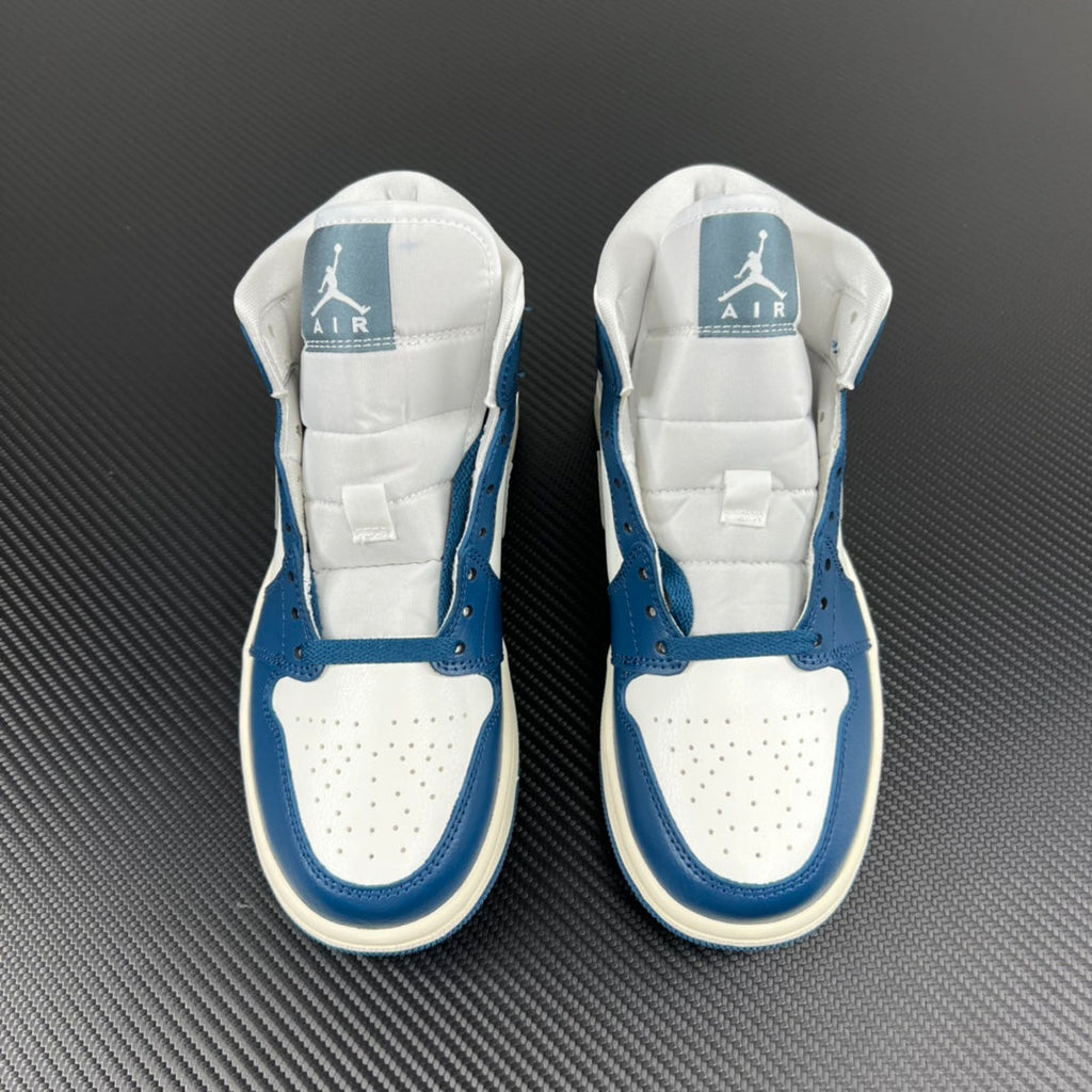 Pair of mid-top sneakers facing upward with blue and white panels and heel logos.
