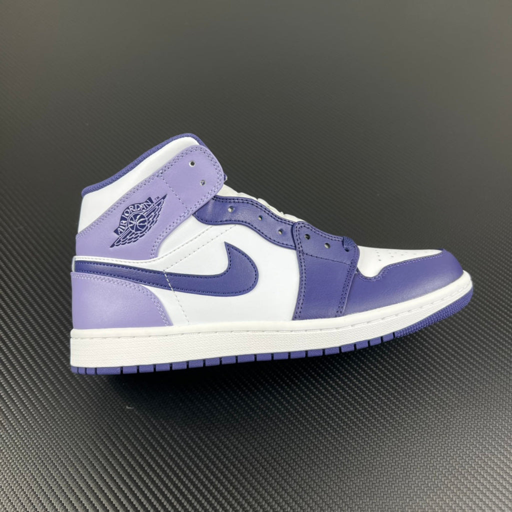 Air Jordan 1 Mid sneakers in white and blue with padded collar and Swoosh