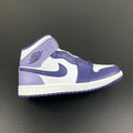 Air Jordan 1 Mid sneakers in white and blue with padded collar and Swoosh