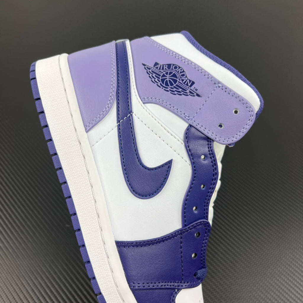 Mid-top sneakers with white base, purple-blue overlays, and Air Jordan wings logo