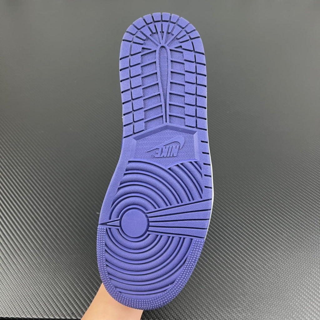 Purple-blue sneaker outsole with raised tread pattern and herringbone grip