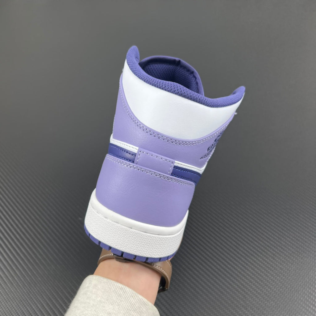 Mid-top sneakers heel view with white and purple-blue panels and padded collar