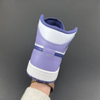 Mid-top sneakers heel view with white and purple-blue panels and padded collar