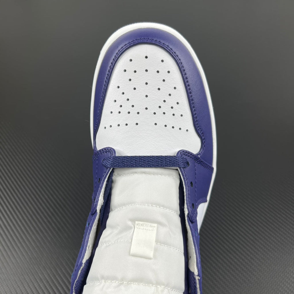 Mid-top sneakers toe box in white with purple-blue overlays and ventilation perforations