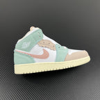 Air Jordan 1 Mid sneaker in mint green, white, beige, and light pink accents with Nike Swoosh