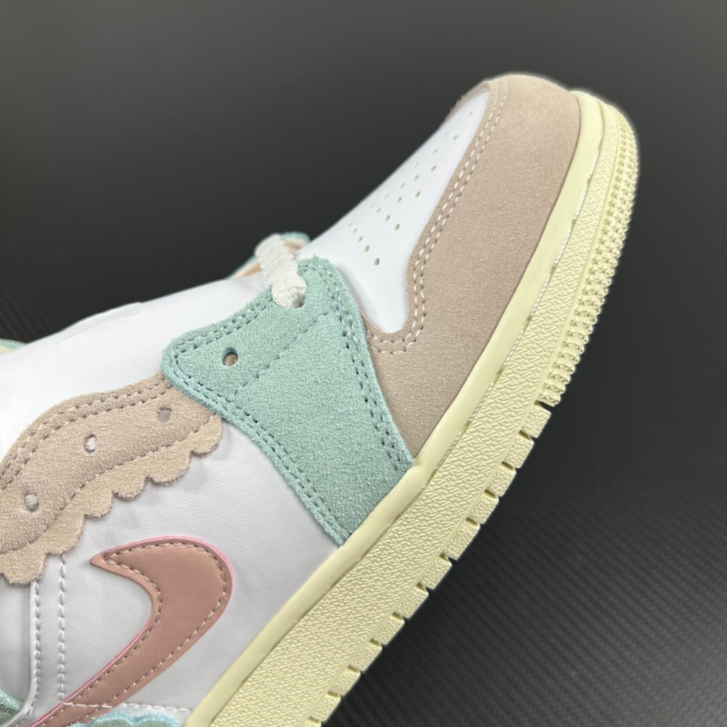 Air Jordan 1 Mid sneaker side view with mint suede panels, beige overlays, and pale yellow sole