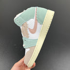 Air Jordan 1 Mid sneaker heel and side view, showing mint overlays and pale yellow outsole