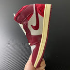 Mid-top sneakers side angle with burgundy leather, white accents, and beige rubber sole