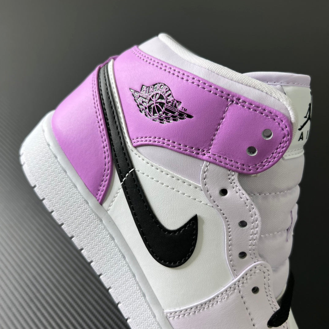 Air Jordan 1 Mid heel strap detail, purple leather panel with wing logo and black accents