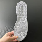 Air Jordan 1 Mid outsole view, textured white rubber with traction pattern