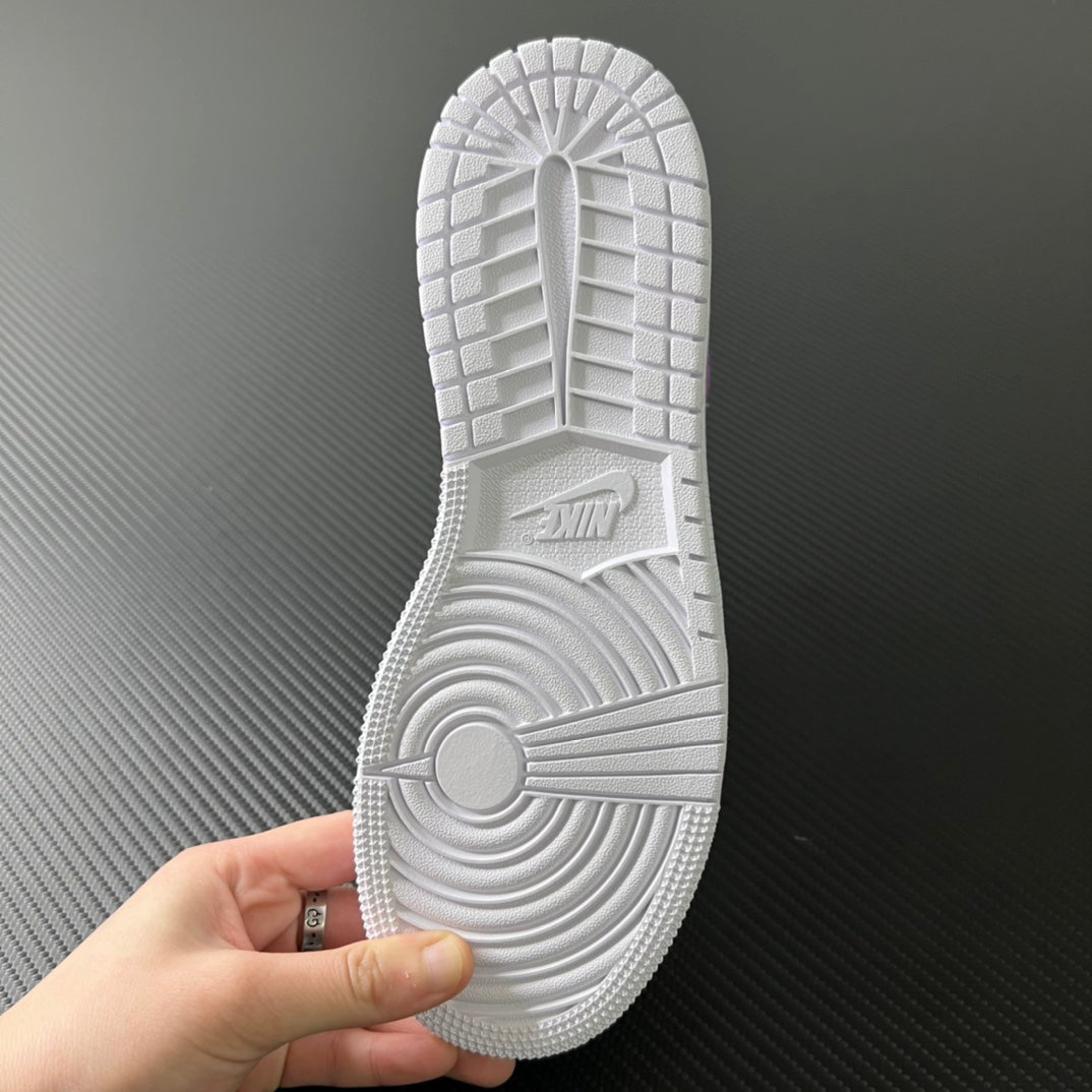 Air Jordan 1 Mid outsole view, textured white rubber with traction pattern